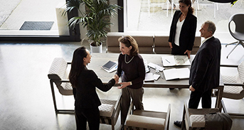 Woman examines economic data in futuristic office