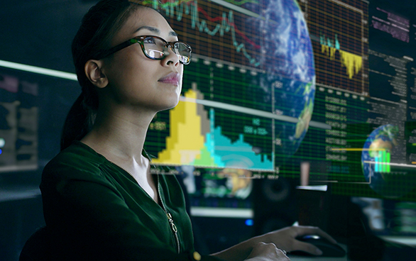 Woman examines economic data in futuristic office